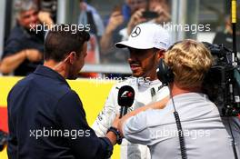 Pole sitter Lewis Hamilton (GBR) Mercedes AMG F1 in qualifying parc ferme with Will Buxton (GBR) NBC Sports Network TV Presenter. 26.08.2017. Formula 1 World Championship, Rd 12, Belgian Grand Prix, Spa Francorchamps, Belgium, Qualifying Day.