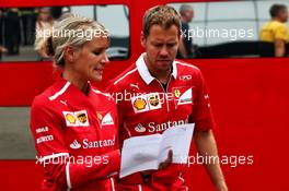 Sebastian Vettel (GER) Ferrari with Britta Roeske (AUT) Ferrari Press Officer. 24.08.2017. Formula 1 World Championship, Rd 12, Belgian Grand Prix, Spa Francorchamps, Belgium, Preparation Day.