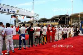 Drivers as the grid observes the national anthem. 16.04.2017. Formula 1 World Championship, Rd 3, Bahrain Grand Prix, Sakhir, Bahrain, Race Day.