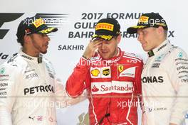 The podium (L to R): Lewis Hamilton (GBR) Mercedes AMG F1, second; Sebastian Vettel (GER) Ferrari, race winner; Valtteri Bottas (FIN) Mercedes AMG F1, third. 16.04.2017. Formula 1 World Championship, Rd 3, Bahrain Grand Prix, Sakhir, Bahrain, Race Day.