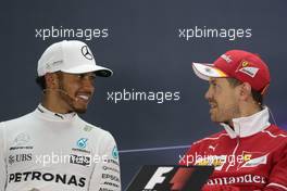 (L to R): Lewis Hamilton (GBR) Mercedes AMG F1 and Sebastian Vettel (GER) Ferrari in the FIA Press Conference. 16.04.2017. Formula 1 World Championship, Rd 3, Bahrain Grand Prix, Sakhir, Bahrain, Race Day.
