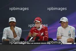 The  FIA Press Conference (L to R): Lewis Hamilton (GBR) Mercedes AMG F1, second; Sebastian Vettel (GER) Ferrari, race winner; Valtteri Bottas (FIN) Mercedes AMG F1, third. 16.04.2017. Formula 1 World Championship, Rd 3, Bahrain Grand Prix, Sakhir, Bahrain, Race Day.