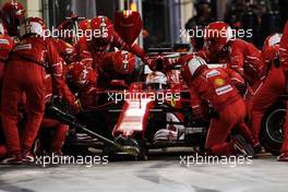 Sebastian Vettel (GER) Ferrari SF70H makes a pit stop. 16.04.2017. Formula 1 World Championship, Rd 3, Bahrain Grand Prix, Sakhir, Bahrain, Race Day.
