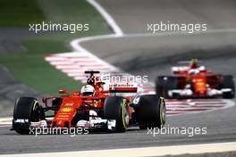 Sebastian Vettel (GER) Scuderia Ferrari and Kimi Raikkonen (FIN) Scuderia Ferrari  16.04.2017. Formula 1 World Championship, Rd 3, Bahrain Grand Prix, Sakhir, Bahrain, Race Day.