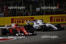 Kimi Raikkonen (FIN) Ferrari SF70H and Felipe Massa (BRA) Williams FW40 battle for position. 16.04.2017. Formula 1 World Championship, Rd 3, Bahrain Grand Prix, Sakhir, Bahrain, Race Day.