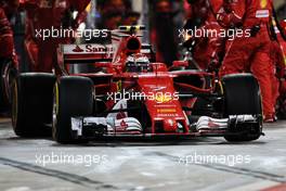 Kimi Raikkonen (FIN) Ferrari SF70H makes a pit stop. 16.04.2017. Formula 1 World Championship, Rd 3, Bahrain Grand Prix, Sakhir, Bahrain, Race Day.