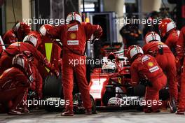 Sebastian Vettel (GER) Ferrari SF70H makes a pit stop. 16.04.2017. Formula 1 World Championship, Rd 3, Bahrain Grand Prix, Sakhir, Bahrain, Race Day.