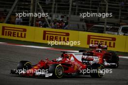 Sebastian Vettel (GER) Ferrari SF70H leads team mate Kimi Raikkonen (FIN) Ferrari SF70H. 16.04.2017. Formula 1 World Championship, Rd 3, Bahrain Grand Prix, Sakhir, Bahrain, Race Day.