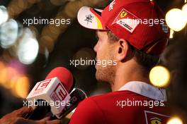 Sebastian Vettel (GER) Ferrari with the media. 15.04.2017. Formula 1 World Championship, Rd 3, Bahrain Grand Prix, Sakhir, Bahrain, Qualifying Day.