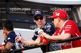 (L to R): Daniil Kvyat (RUS) Scuderia Toro Rosso with Kimi Raikkonen (FIN) Ferrari, on the drivers parade. 16.04.2017. Formula 1 World Championship, Rd 3, Bahrain Grand Prix, Sakhir, Bahrain, Race Day.