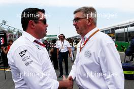 (L to R): Eric Boullier (FRA) McLaren Racing Director with Ross Brawn (GBR) Managing Director, Motor Sports on the grid. 11.06.2017. Formula 1 World Championship, Rd 7, Canadian Grand Prix, Montreal, Canada, Race Day.