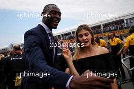 (L to R): Bismack Biyombo, NBA Basketball Player and Eugenie Bouchard (CDN) Tennis Player on the grid with the Renault Sport F1 Team. 11.06.2017. Formula 1 World Championship, Rd 7, Canadian Grand Prix, Montreal, Canada, Race Day.