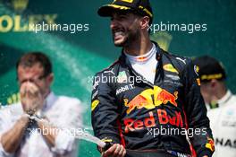 Daniel Ricciardo (AUS) Red Bull Racing celebrates his third position with the champagne on the podium. 11.06.2017. Formula 1 World Championship, Rd 7, Canadian Grand Prix, Montreal, Canada, Race Day.