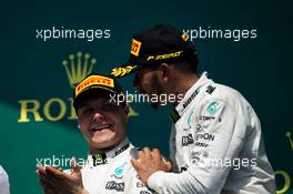 (L to R): Second placed Valtteri Bottas (FIN) Mercedes AMG F1 with team mate and race winner Lewis Hamilton (GBR) Mercedes AMG F1 on the podium. 11.06.2017. Formula 1 World Championship, Rd 7, Canadian Grand Prix, Montreal, Canada, Race Day.