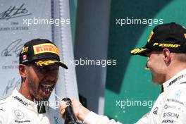 (L to R): Race winner Lewis Hamilton (GBR) Mercedes AMG F1 celebrates on the podium with second placed team mate Valtteri Bottas (FIN) Mercedes AMG F1. 11.06.2017. Formula 1 World Championship, Rd 7, Canadian Grand Prix, Montreal, Canada, Race Day.