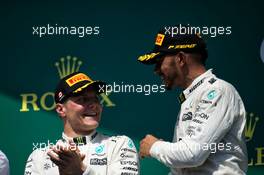 (L to R): Second placed Valtteri Bottas (FIN) Mercedes AMG F1 with team mate and race winner Lewis Hamilton (GBR) Mercedes AMG F1 on the podium. 11.06.2017. Formula 1 World Championship, Rd 7, Canadian Grand Prix, Montreal, Canada, Race Day.