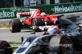 Sebastian Vettel (GER) Ferrari SF70H follows Romain Grosjean (FRA) Haas F1 Team VF-17. 11.06.2017. Formula 1 World Championship, Rd 7, Canadian Grand Prix, Montreal, Canada, Race Day.