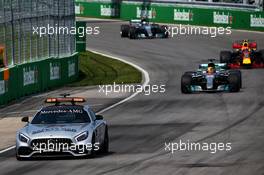 Lewis Hamilton (GBR) Mercedes AMG F1 W08 leads behind the FIA Safety Car. 11.06.2017. Formula 1 World Championship, Rd 7, Canadian Grand Prix, Montreal, Canada, Race Day.