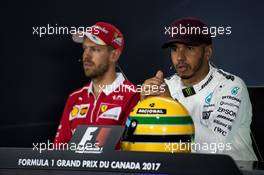 (L to R): Sebastian Vettel (GER) Ferrari with Lewis Hamilton (GBR) Mercedes AMG F1 in the FIA Press Conference. 10.06.2017. Formula 1 World Championship, Rd 7, Canadian Grand Prix, Montreal, Canada, Qualifying Day.