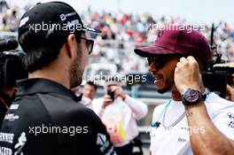 Lewis Hamilton (GBR) Mercedes AMG F1 with Sergio Perez (MEX) Sahara Force India F1 on the drivers parade. 11.06.2017. Formula 1 World Championship, Rd 7, Canadian Grand Prix, Montreal, Canada, Race Day.