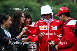 Kimi Raikkonen (FIN) Ferrari signs autographs for the fans. 07.04.2017. Formula 1 World Championship, Rd 2, Chinese Grand Prix, Shanghai, China, Practice Day.