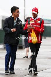 Sebastian Vettel (GER) Ferrari signs autographs for the fans. 07.04.2017. Formula 1 World Championship, Rd 2, Chinese Grand Prix, Shanghai, China, Practice Day.