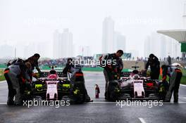Esteban Ocon (FRA) Sahara Force India F1 VJM10 and Sergio Perez (MEX) Sahara Force India F1 VJM10 on the grid. 09.04.2017. Formula 1 World Championship, Rd 2, Chinese Grand Prix, Shanghai, China, Race Day.