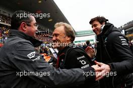 (L to R): Eric Boullier (FRA) McLaren Racing Director with Robert Fernley (GBR) Sahara Force India F1 Team Deputy Team Principal and Toto Wolff (GER) Mercedes AMG F1 Shareholder and Executive Director on the grid. 09.04.2017. Formula 1 World Championship, Rd 2, Chinese Grand Prix, Shanghai, China, Race Day.