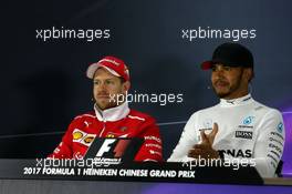 (L to R): Sebastian Vettel (GER) Ferrari and Lewis Hamilton (GBR) Mercedes AMG F1 in the FIA Press Conference. 09.04.2017. Formula 1 World Championship, Rd 2, Chinese Grand Prix, Shanghai, China, Race Day.