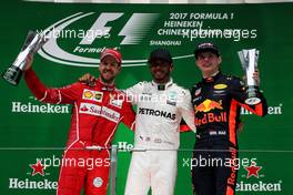 The podium (L to R): Sebastian Vettel (GER) Ferrari, second; Lewis Hamilton (GBR) Mercedes AMG F1, race winner; Max Verstappen (NLD) Red Bull Racing, third. 09.04.2017. Formula 1 World Championship, Rd 2, Chinese Grand Prix, Shanghai, China, Race Day.