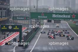 Lewis Hamilton (GBR) Mercedes AMG F1 W08 leads at the start of the race with Jolyon Palmer (GBR) Renault Sport F1 Team RS17 at the pit lane exit. 09.04.2017. Formula 1 World Championship, Rd 2, Chinese Grand Prix, Shanghai, China, Race Day.