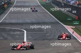 Kimi Raikkonen (FIN) Ferrari SF70H leads team mate Sebastian Vettel (GER) Ferrari SF70H. 09.04.2017. Formula 1 World Championship, Rd 2, Chinese Grand Prix, Shanghai, China, Race Day.