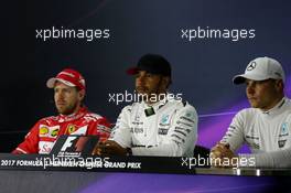 The FIA Press Conference (L to R): Sebastian Vettel (GER) Ferrari, Lewis Hamilton (GBR) Mercedes AMG F1; Valtteri Bottas (FIN) Mercedes AMG F1. 08.04.2017. Formula 1 World Championship, Rd 2, Chinese Grand Prix, Shanghai, China, Qualifying Day.