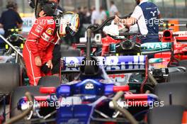 Sebastian Vettel (GER) Ferrari checking out the Mercedes. 08.04.2017. Formula 1 World Championship, Rd 2, Chinese Grand Prix, Shanghai, China, Qualifying Day.