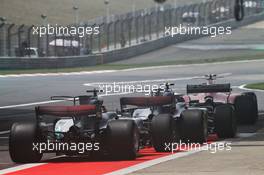 Kimi Raikkonen (FIN) Ferrari SF70H, Valtteri Bottas (FIN) Mercedes AMG F1 W08, and Lewis Hamilton (GBR) Mercedes AMG F1 W08, at the pit lane exit. 08.04.2017. Formula 1 World Championship, Rd 2, Chinese Grand Prix, Shanghai, China, Qualifying Day.