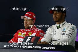 (L to R): Sebastian Vettel (GER) Ferrari and Lewis Hamilton (GBR) Mercedes AMG F1 in the FIA Press Conference. 08.04.2017. Formula 1 World Championship, Rd 2, Chinese Grand Prix, Shanghai, China, Qualifying Day.