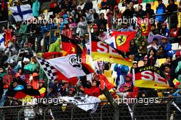 Fans in the grandstand and flags for Sebastian Vettel (GER) Ferrari. 09.04.2017. Formula 1 World Championship, Rd 2, Chinese Grand Prix, Shanghai, China, Race Day.