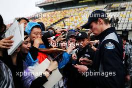 Daniil Kvyat (RUS) Scuderia Toro Rosso signs autographs for the fans. 06.04.2017. Formula 1 World Championship, Rd 2, Chinese Grand Prix, Shanghai, China, Preparation Day.