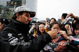 Sergio Perez (MEX) Sahara Force India F1 signs autographs for the fans. 06.04.2017. Formula 1 World Championship, Rd 2, Chinese Grand Prix, Shanghai, China, Preparation Day.