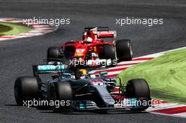 Lewis Hamilton (GBR) Mercedes AMG F1 W08 leads Sebastian Vettel (GER) Ferrari SF70H. 14.05.2017. Formula 1 World Championship, Rd 5, Spanish Grand Prix, Barcelona, Spain, Race Day.
