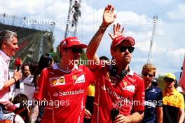(L to R): Kimi Raikkonen (FIN) Ferrari and Sebastian Vettel (GER) Ferrari on the drivers parade. 14.05.2017. Formula 1 World Championship, Rd 5, Spanish Grand Prix, Barcelona, Spain, Race Day.