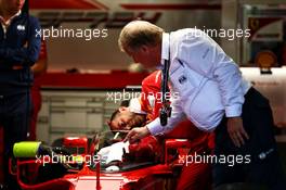 Jo Bauer (GER) FIA Delegate looks at a cockpit cover on the Ferrari SF70H of Sebastian Vettel (GER) Ferrari. 13.07.2017. Formula 1 World Championship, Rd 10, British Grand Prix, Silverstone, England, Preparation Day.