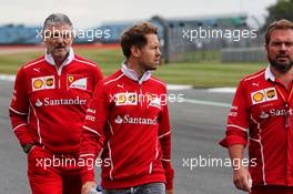 Sebastian Vettel (GER) Ferrari walks the circuit with the team with Maurizio Arrivabene (ITA) Ferrari Team Principal, Gino Rosato (CDN) Ferrari, and the team. 13.07.2017. Formula 1 World Championship, Rd 10, British Grand Prix, Silverstone, England, Preparation Day.