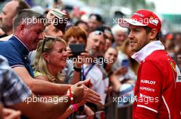 Sebastian Vettel (GER) Ferrari with fans. 13.07.2017. Formula 1 World Championship, Rd 10, British Grand Prix, Silverstone, England, Preparation Day.