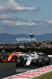 Felipe Massa (BRA) Williams FW40 and Fernando Alonso (ESP) McLaren MCL32. 28.07.2017. Formula 1 World Championship, Rd 11, Hungarian Grand Prix, Budapest, Hungary, Practice Day.