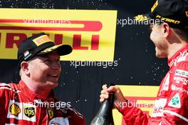 (L to R): Kimi Raikkonen (FIN) Ferrari celebrates his second position on the podium with team mate and race winner Sebastian Vettel (GER) Ferrari. 30.07.2017. Formula 1 World Championship, Rd 11, Hungarian Grand Prix, Budapest, Hungary, Race Day.