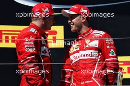 (L to R): second placed Kimi Raikkonen (FIN) Ferrari with team mate and race winner Sebastian Vettel (GER) Ferrari. 30.07.2017. Formula 1 World Championship, Rd 11, Hungarian Grand Prix, Budapest, Hungary, Race Day.