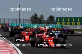 Sebastian Vettel (GER) Ferrari SF70H leads at the start of the race. 30.07.2017. Formula 1 World Championship, Rd 11, Hungarian Grand Prix, Budapest, Hungary, Race Day.