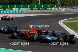 Max Verstappen (NLD) Red Bull Racing RB13 and Lewis Hamilton (GBR) Mercedes AMG F1 W08 battle for position. 30.07.2017. Formula 1 World Championship, Rd 11, Hungarian Grand Prix, Budapest, Hungary, Race Day.