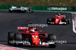 Sebastian Vettel (GER) Ferrari SF70H leads team mate Kimi Raikkonen (FIN) Ferrari SF70H. 30.07.2017. Formula 1 World Championship, Rd 11, Hungarian Grand Prix, Budapest, Hungary, Race Day.